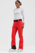 Women's black Les Odettes slim fit fleece-lined ski pants with a sleek design and adjustable waistband, perfect for winter sports.