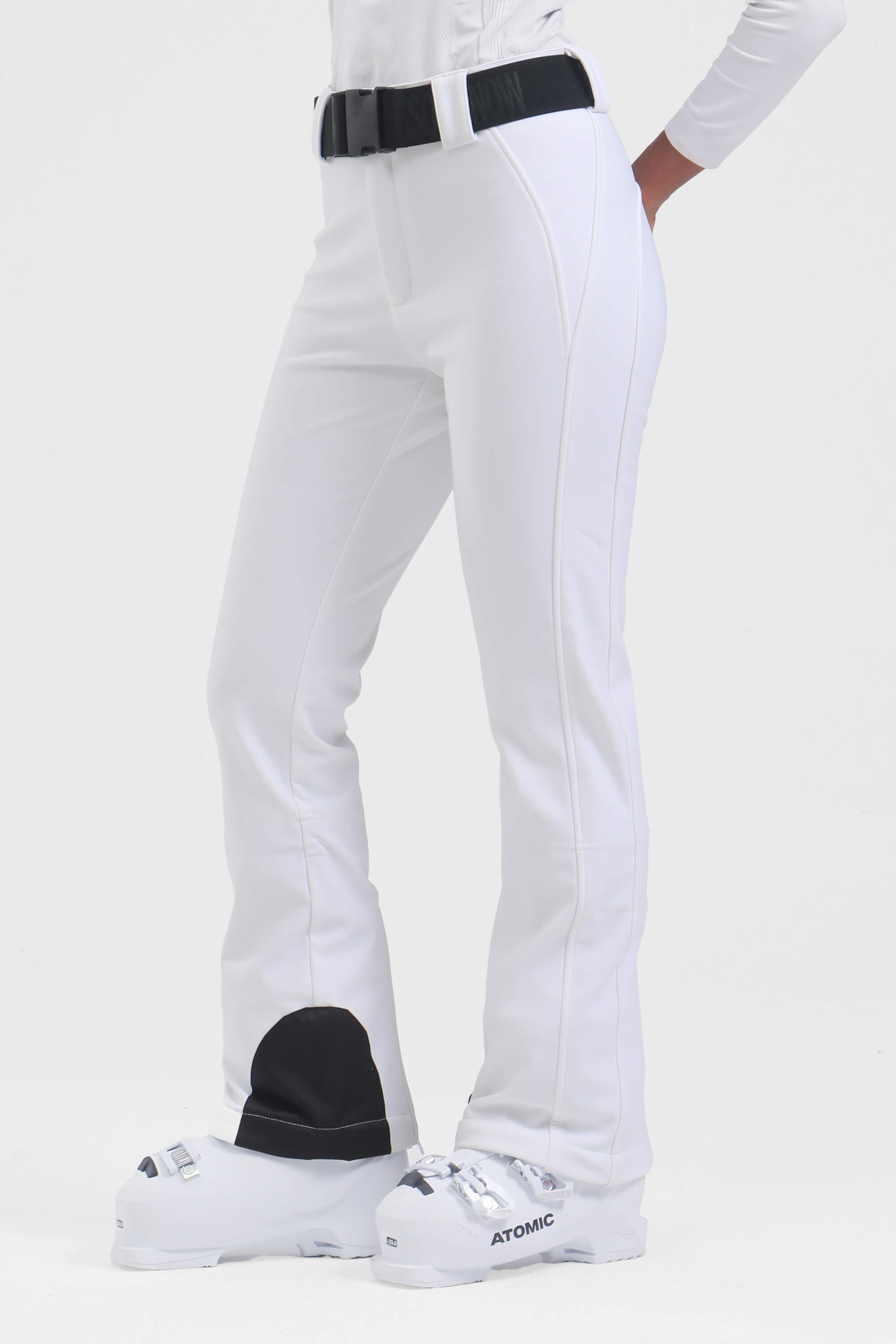Women's black wearable slim fit fleece-lined ski pants by Les Odettes, showing the fitted design and cozy fleece interior.
