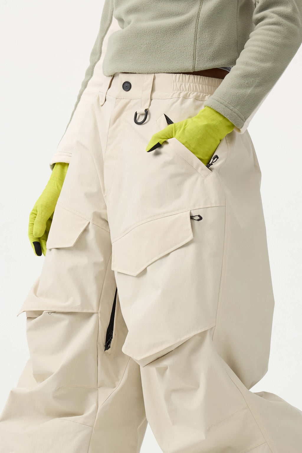 Women's black baggy utility snow pants by Les Odettes, weather-resistant with reinforced wear-resistant fabric, shown on a model.
