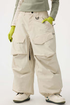 Women's black baggy utility snow pants by Les Odettes, wear-resistant and suitable for winter snow activities.