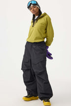 Women's black baggy utility snow pants by Les Odettes, durable wear-resistant fabric, designed for winter outdoor activities.