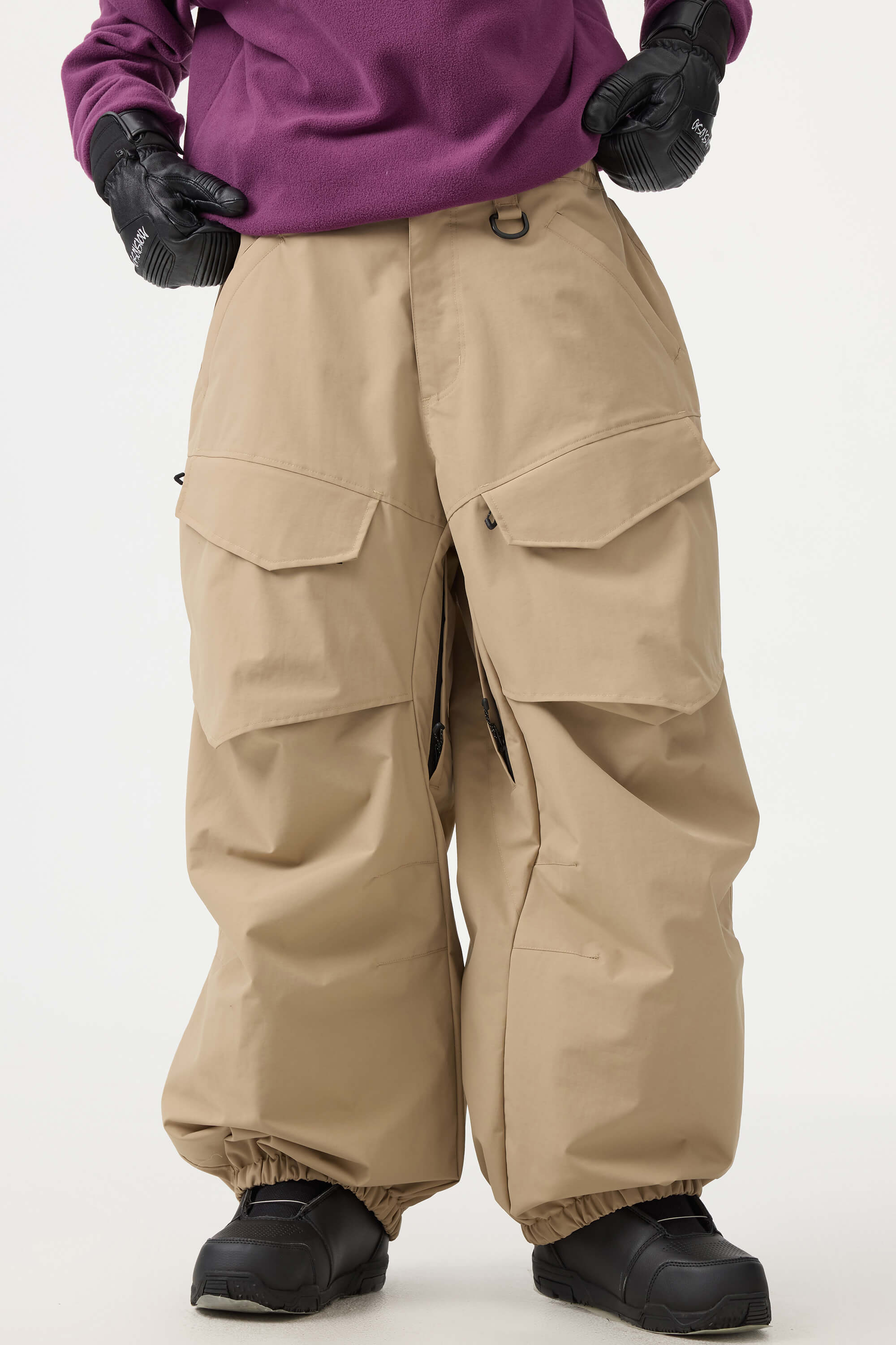 Women's black baggy utility snow pants by Les Odettes, durable wear-resistant fabric, designed for cold weather winter activities.