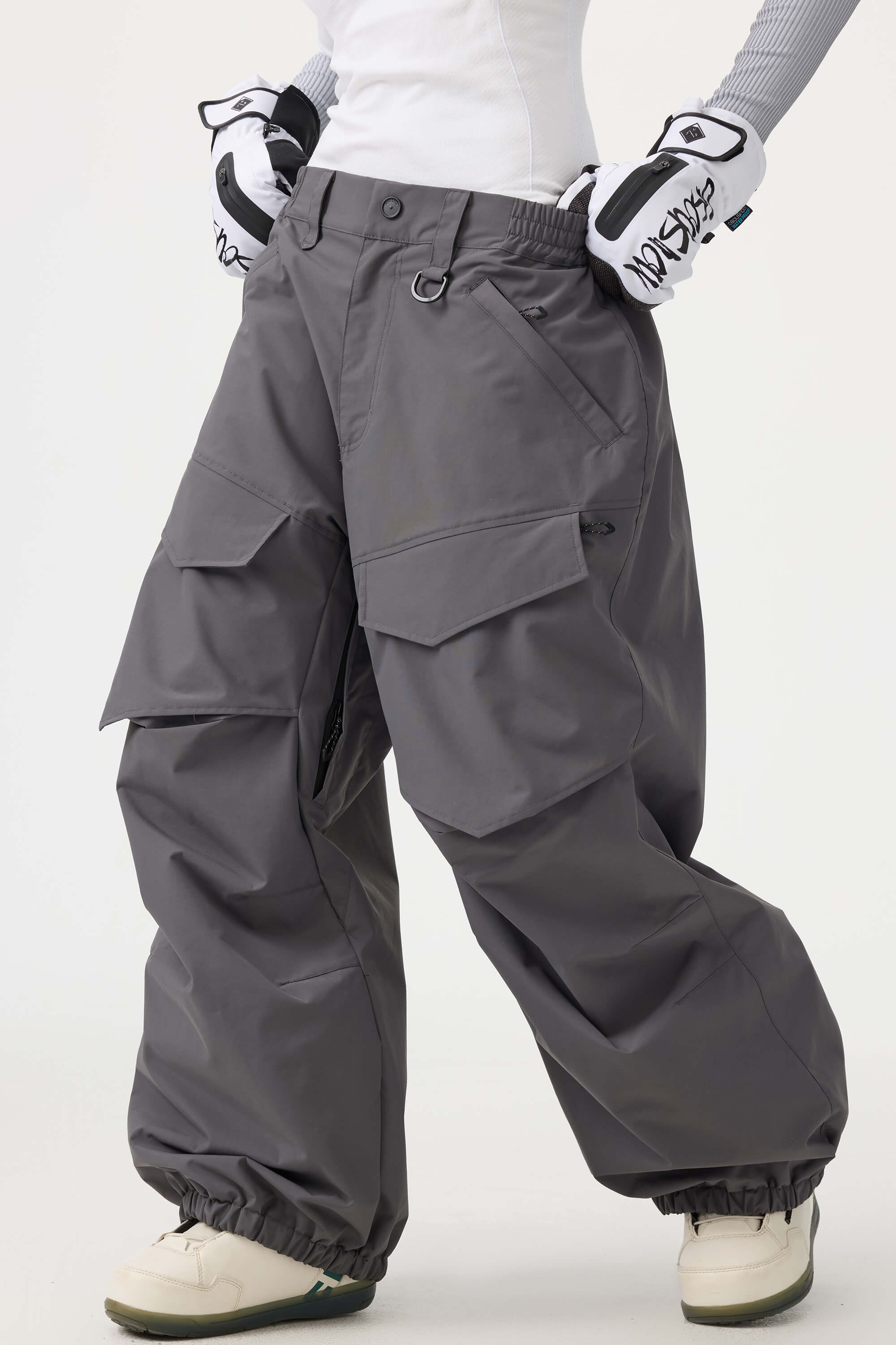 Women's black utility snow pants by Les Odettes with a relaxed fit, wear-resistant fabric, suitable for winter outdoor activities.