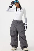 Women's black baggy utility snow pants by Les Odettes, durable and wear-resistant for winter outdoor activities.