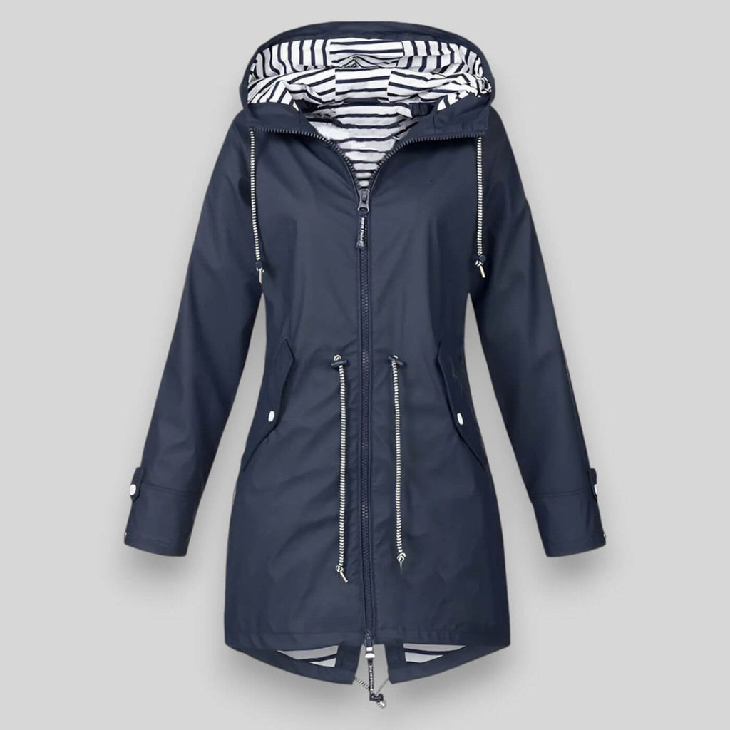 Noa™ waterproof jacket by Les Odettes, sleek coat with a modern fit, shown on a model in a city outdoor setting.