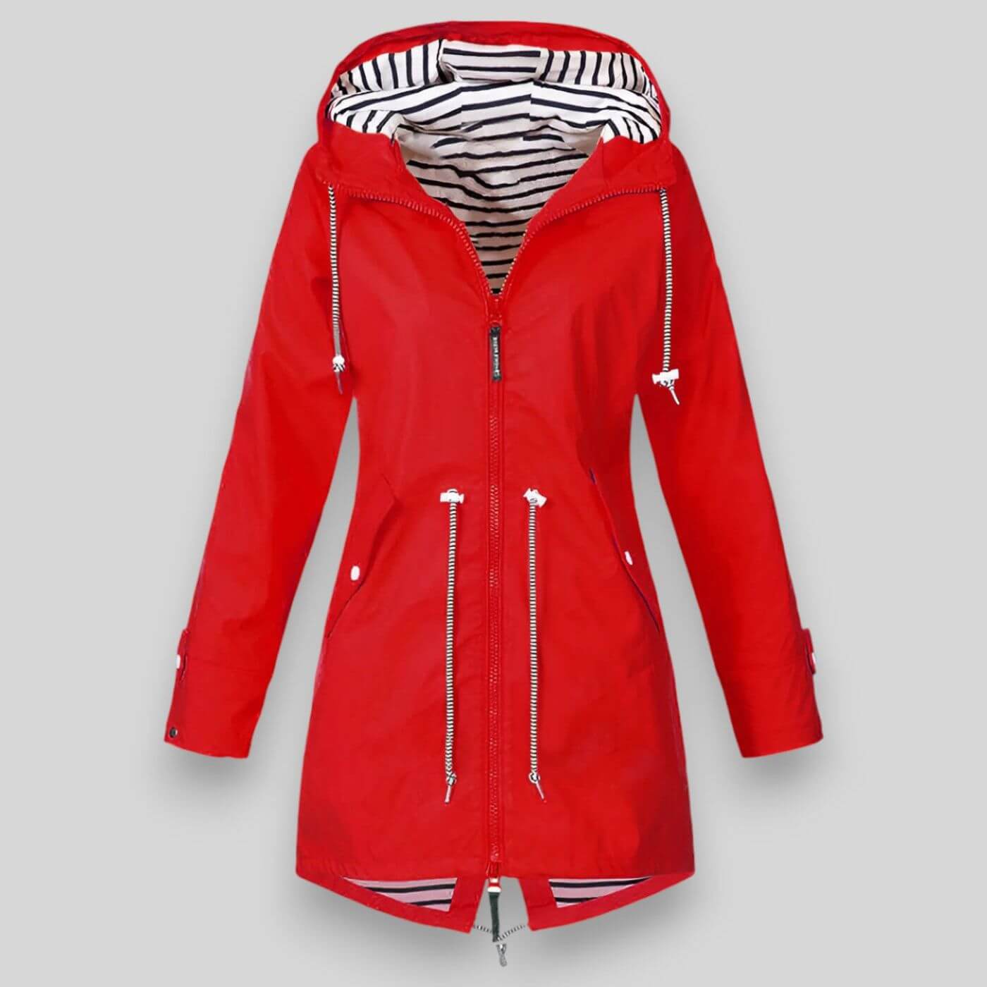 Noa™ waterproof jacket by Les Odettes, sleek coat with a hood, shown in a modern outdoor setting with urban architecture.