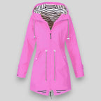 Noa™ sleek waterproof jacket by Les Odettes, shown in a stylish coat with a modern design, suitable for rainy weather.