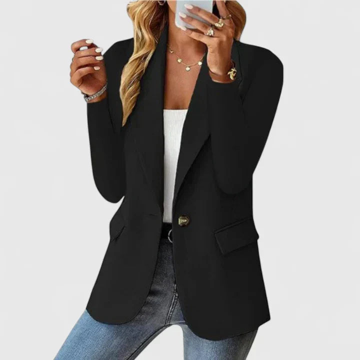 Elegant black Grace™ blazer by Les Odettes, tailored fit with lapel collar, displayed on a hanger against a plain background.