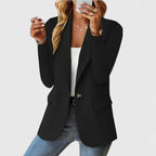 Elegant black Grace™ blazer by Les Odettes, tailored fit with lapel collar, displayed on a hanger against a plain background.