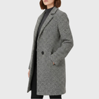 Herlie™ warm winter coat by Les Odettes featuring a cozy, insulated design with a hood and stylish details.
