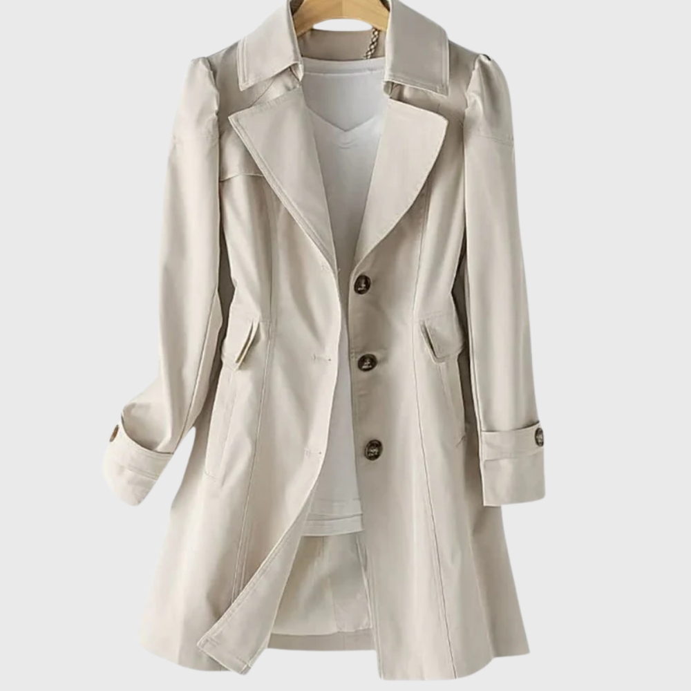 Les Odettes Merivel™ everyday rain coat in waterproof fabric, shown hanging with a hood and classic design for rainy weather.