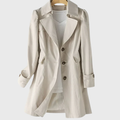 Les Odettes Merivel™ everyday rain coat in waterproof fabric, shown hanging with a hood and classic design for rainy weather.
