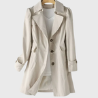 Les Odettes Merivel™ everyday rain coat in waterproof fabric, shown hanging with a hood and classic design for rainy weather.