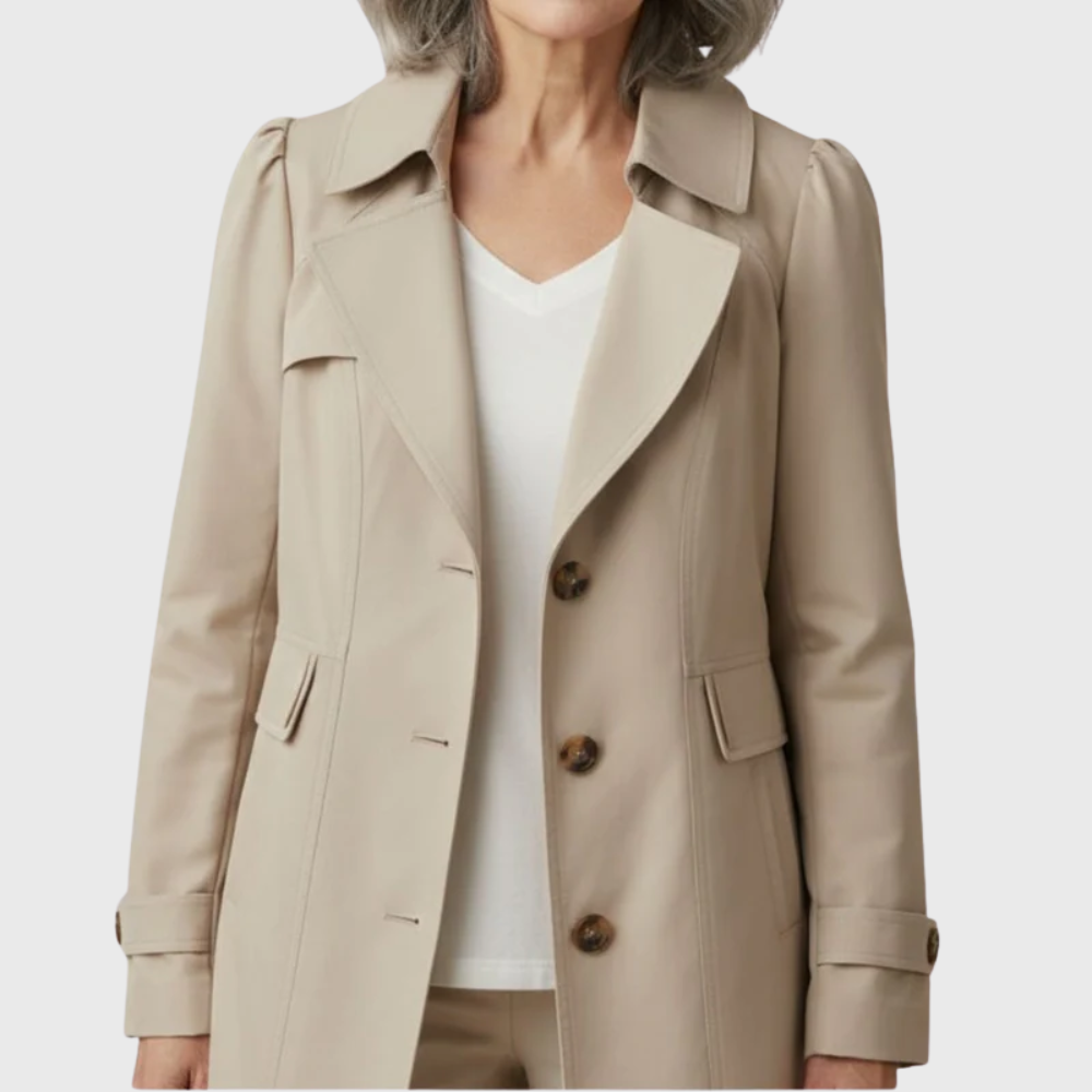 Les Odettes Merivel™ Everyday Rain Coat in waterproof fabric, shown in a stylish, classic design with a hood and button closures.
