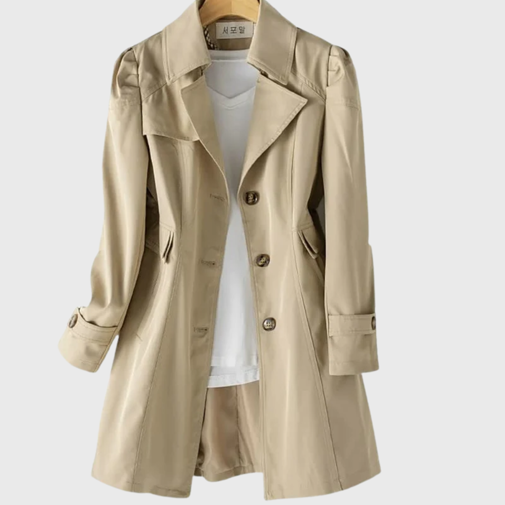 Les Odettes Merivel™ everyday rain coat in navy with hood, waterproof fabric, and button closure, displayed on a hanger.