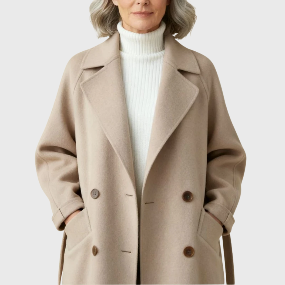Longline Les Odettes Crizza™ overcoat in neutral fabric, featuring a tailored fit and classic lapel collar.