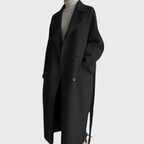 Longline Crizza™ overcoat by Les Odettes in neutral fabric, displayed on a hanger with a tailored collar and sleek silhouette.