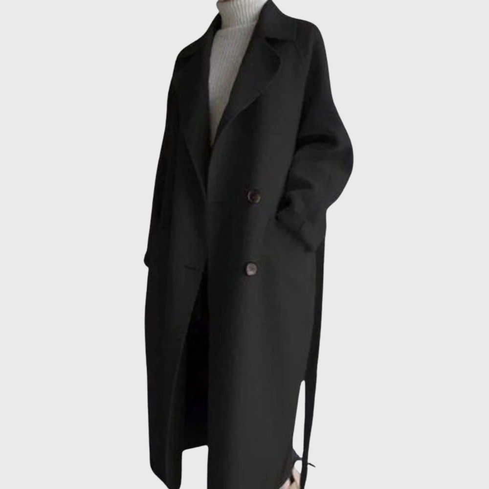Longline Crizza™ overcoat by Les Odettes in neutral fabric, displayed on a hanger with a tailored collar and sleek silhouette.