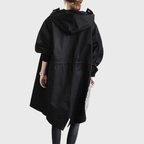 Les Odettes Arline™ waterproof trench coat in classic beige, shown with a double-breasted front and belted waist.