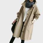 Les Odettes Arline™ waterproof trench coat shown in a classic beige color, featuring a belt and double-breasted design.