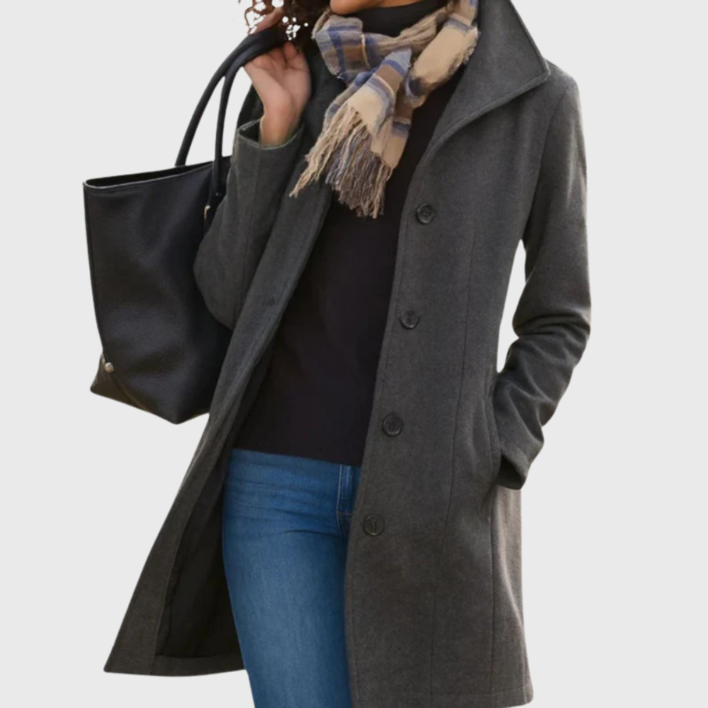 Les Odettes Kimmy™ longline coat featuring a flattering, elegant design with a tailored fit and stylish collar detail.