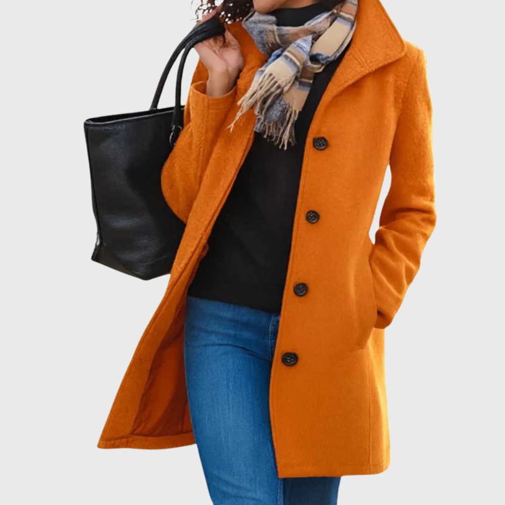 Kimmy™ longline coat by Les Odettes, featuring a flattering fit, tailored design, and neutral color, displayed on a hanger.