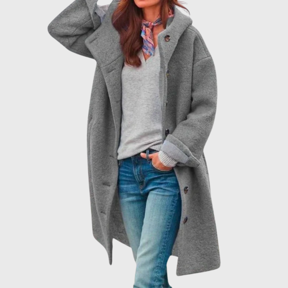 Les Odettes Crishna™ Warm Classic Coat displayed on a hanger, showcasing its cozy fabric and stylish design.