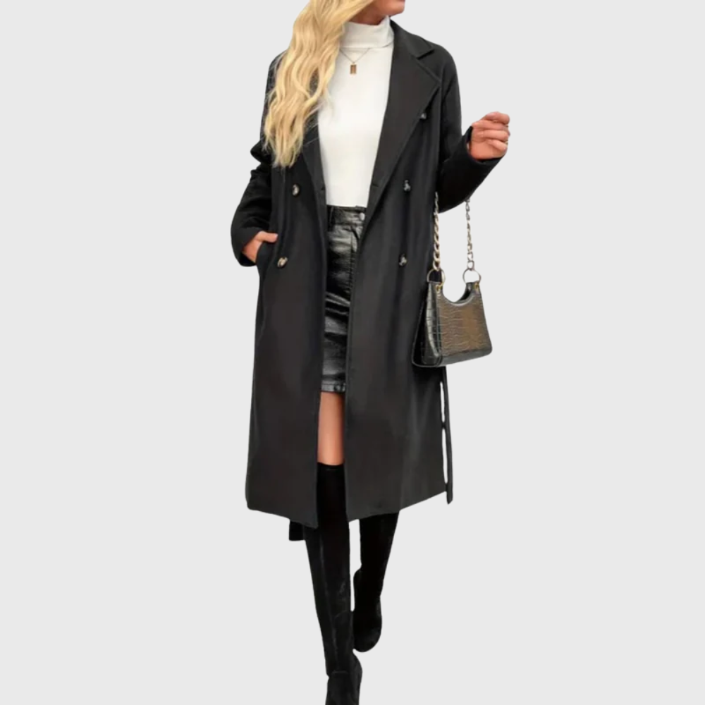 Les Odettes Bianca™ longline winter trench coat displayed on a model, featuring classic double-breasted design and belted waist.