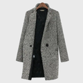 Les Odettes Herlie™ warm winter coat in a cozy, insulated design with a hood and stylish details for cold weather.
