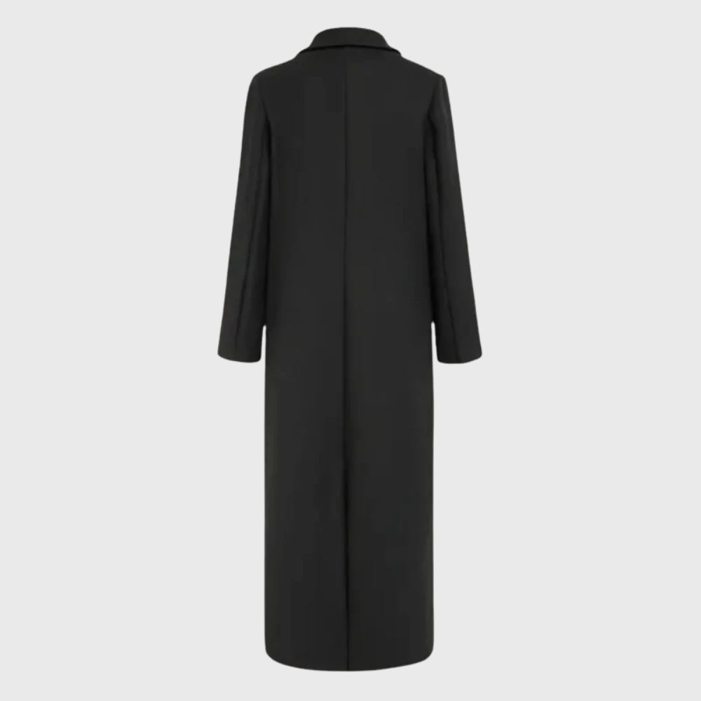 Longline winter trench coat by Les Odettes featuring a tailored fit, classic collar, and button closure, perfect for cold weather.