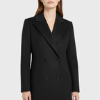 Sally™ longline winter trench coat by Les Odettes, featuring a classic silhouette, double-breasted design, and belted waist in a neutral shade.