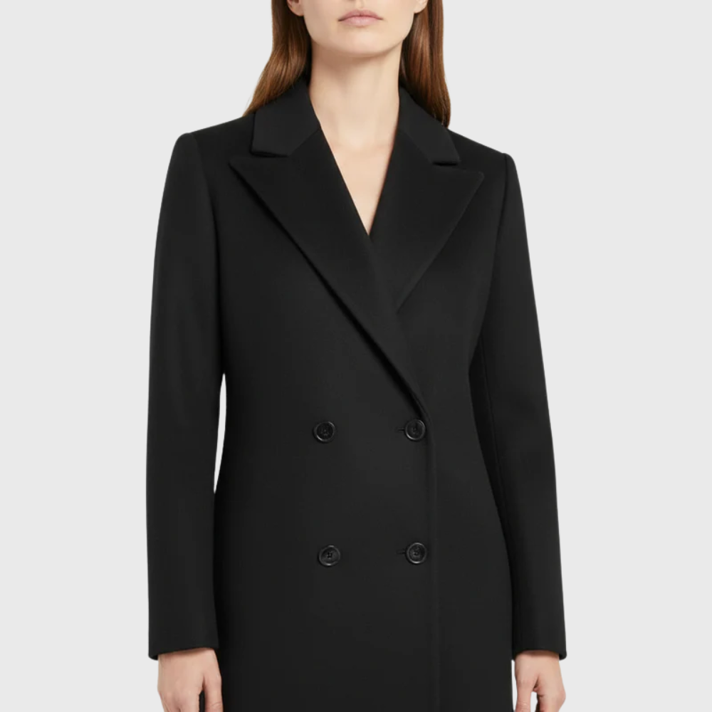 Sally™ longline winter trench coat by Les Odettes, featuring a classic silhouette, double-breasted design, and belted waist in a neutral shade.