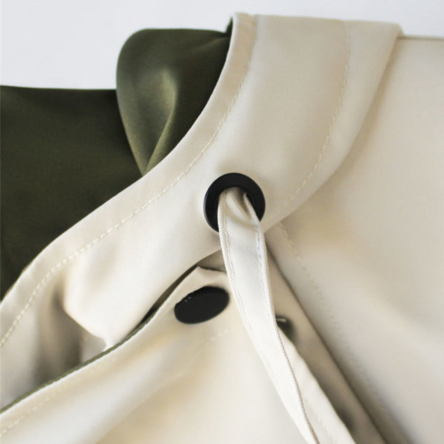Aurelía™ windbreaker jacket by Les Odettes, lightweight outdoor jacket with a hood and adjustable drawstrings, in a neutral color.