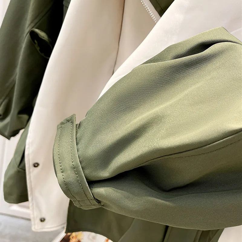Aurelia™ Windbreaker Jacket by Les Odettes, lightweight black jacket with hood and zip front, designed for casual outdoor wear.