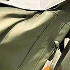 Les Odettes Aurelia™ windbreaker jacket in lightweight fabric, shown in a stylish, wind-resistant design with a hood and zipper front.