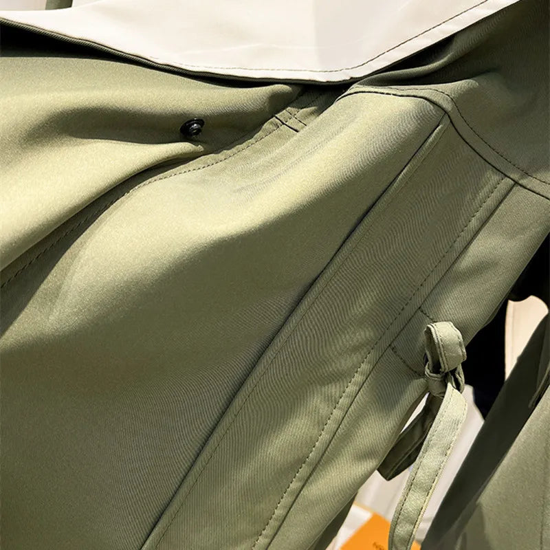 Les Odettes Aurelia™ windbreaker jacket in lightweight fabric, shown in a stylish, wind-resistant design with a hood and zipper front.