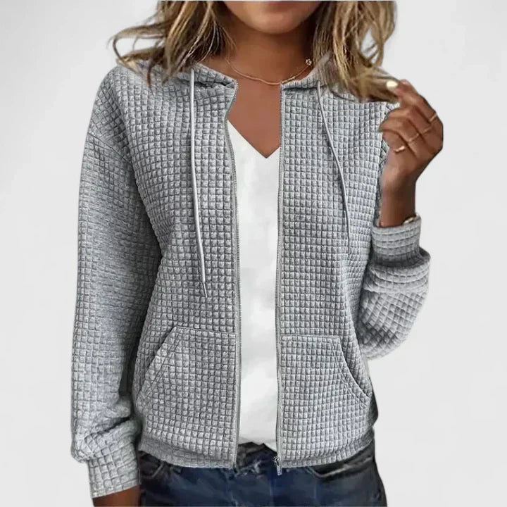 Olivia™ elegant cardigan by Les Odettes, shown in a soft, neutral color with a classic, cozy design and button details.