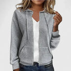 Olivia™ elegant cardigan by Les Odettes, shown in a soft, neutral color with a classic, cozy design and button details.