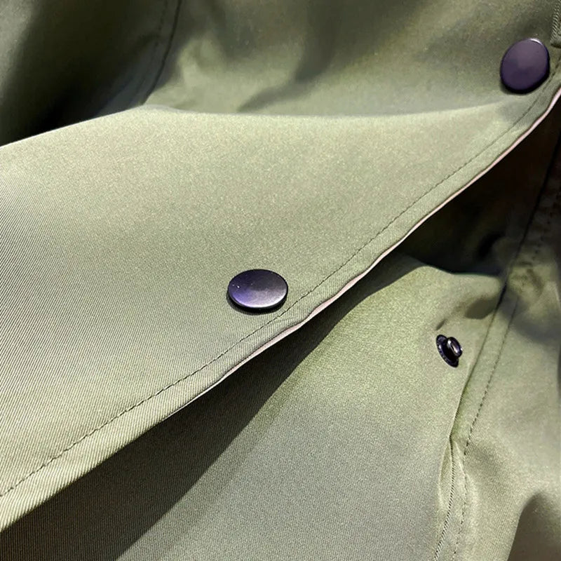 Aurelia™ windbreaker jacket by Les Odettes, lightweight waterproof outerwear in sleek design, shown on a hanger.