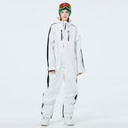Les Odettes Women's AlpineChill SnowStorm one-piece snowsuit in blue, with hood and snow-resistant fabric, suitable for winter outdoor activities.