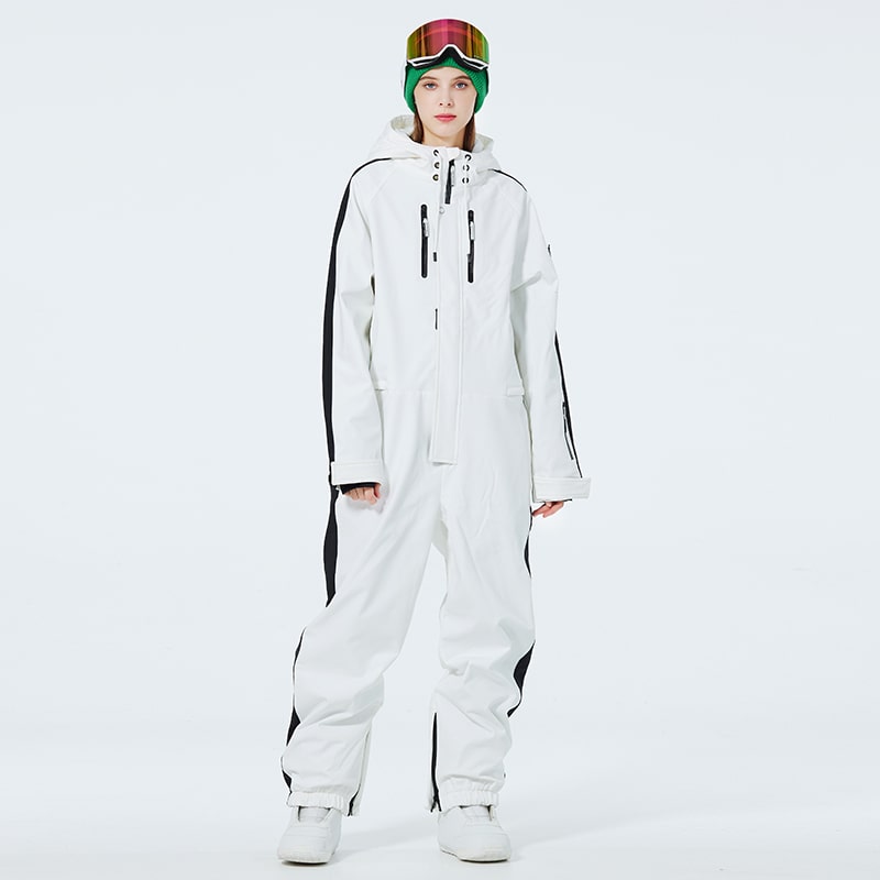 Les Odettes Women's AlpineChill SnowStorm one-piece snowsuit in blue, with hood and snow-resistant fabric, suitable for winter outdoor activities.