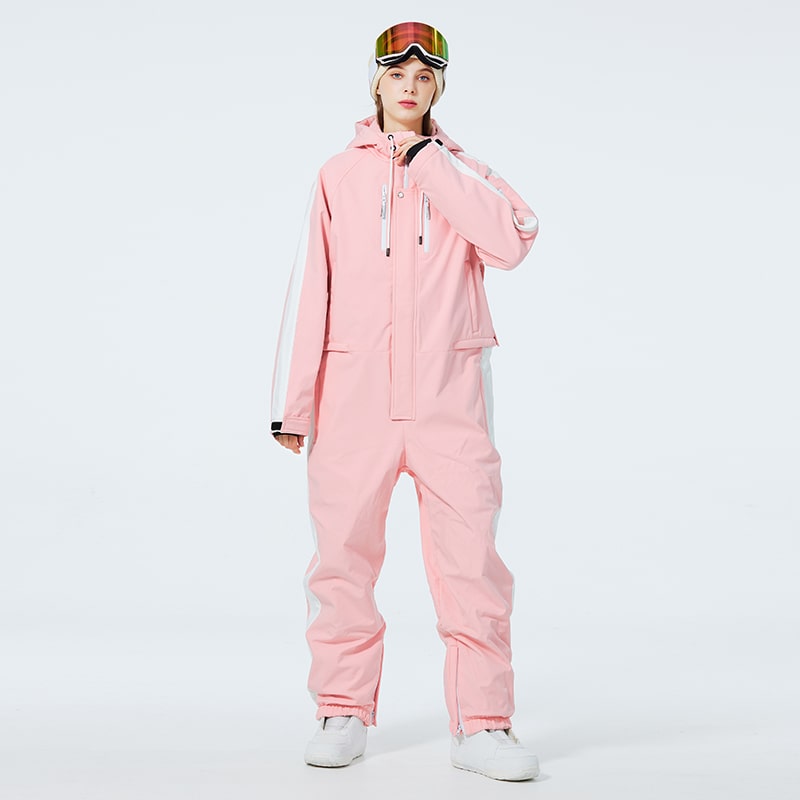 Les Odettes Women's AlpineChill SnowStorm one-piece snowsuit with a hood and winter insulation, designed for cold weather outdoor activities.