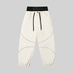 Men's ASHGREEN Winter Peak IcePro snowboarding pants by Les Odettes, featuring insulated, waterproof design with adjustable straps.