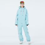 Les Odettes Women's AlpineChill SnowStorm one-piece snowsuit in navy with hood, insulated winter snow gear for women.