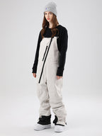 Women's Les Odettes Searipe oblique zipper winter snow pants ski bibs with adjustable straps and snow-resistant fabric.