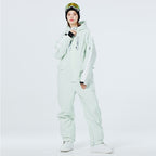 Les Odettes Women's AlpineChill SnowStorm one-piece snowsuit in vibrant winter colors, designed for cold weather outdoor activity.