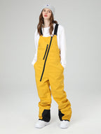 Women's Les Odettes snow pants with oblique zipper design, winter crew snow bibs for skiing, featuring a snug fit and durable fabric.
