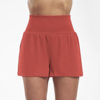 High waisted Les Odettes yoga shorts for women with stretch fit, shown in a close-up of the waistband and fabric details.