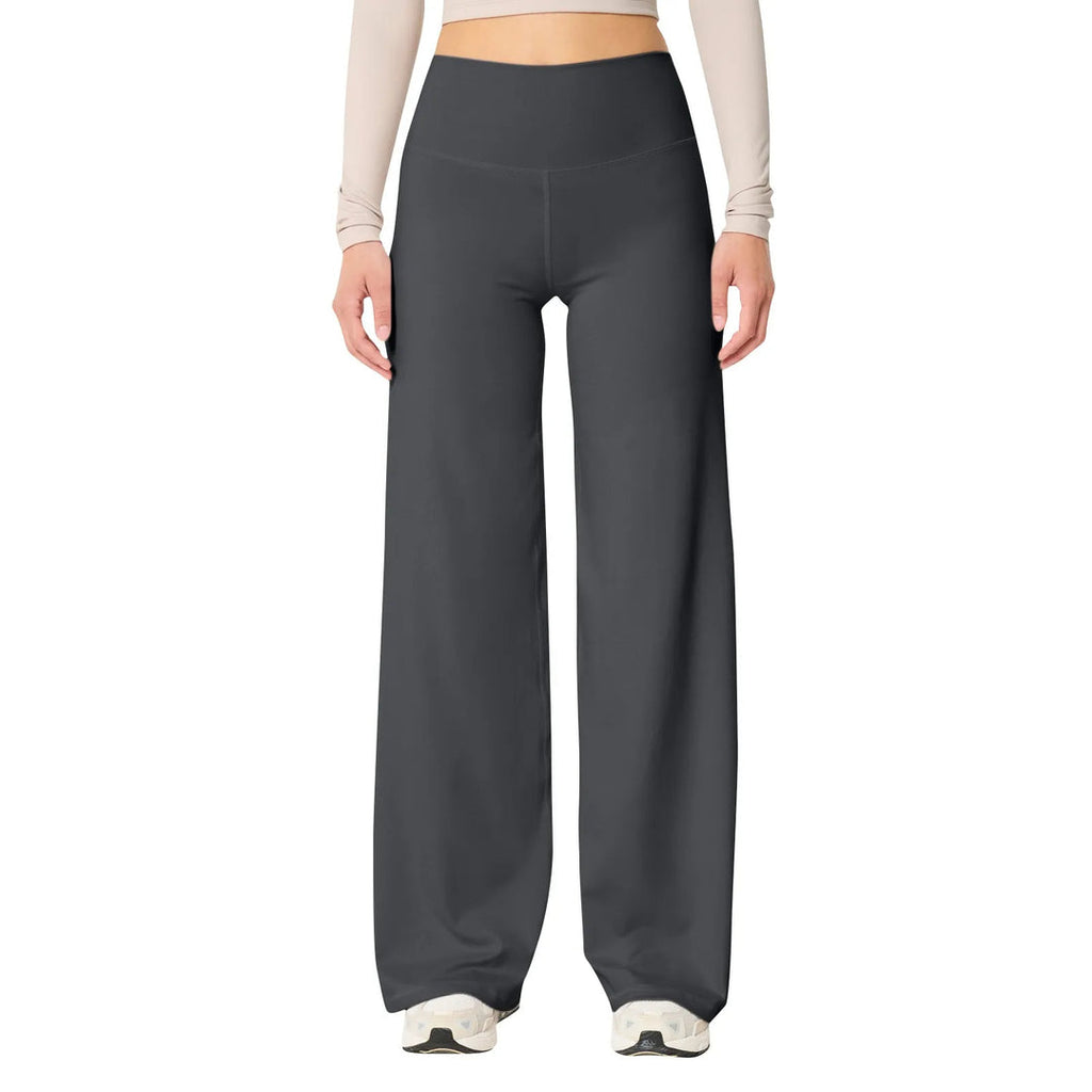 Les Odettes high waisted stretch yoga pants for women in slim fit, showing the black leggings on a model during exercise.