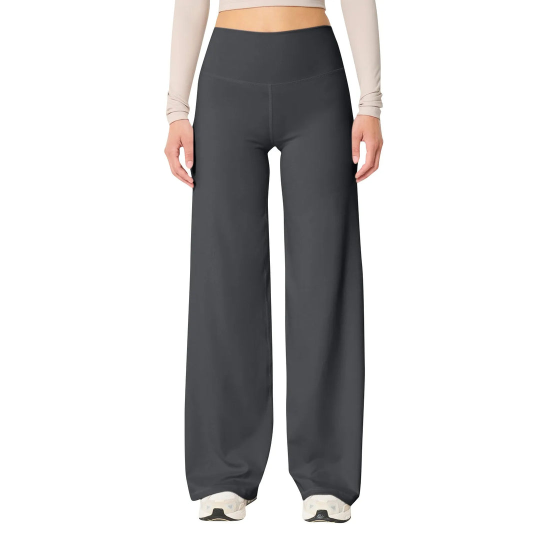 Les Odettes high waisted stretch yoga pants for women in slim fit, showing the black leggings on a model during exercise.